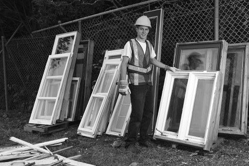 Professionals conducting loft clearance in a Greenwich home